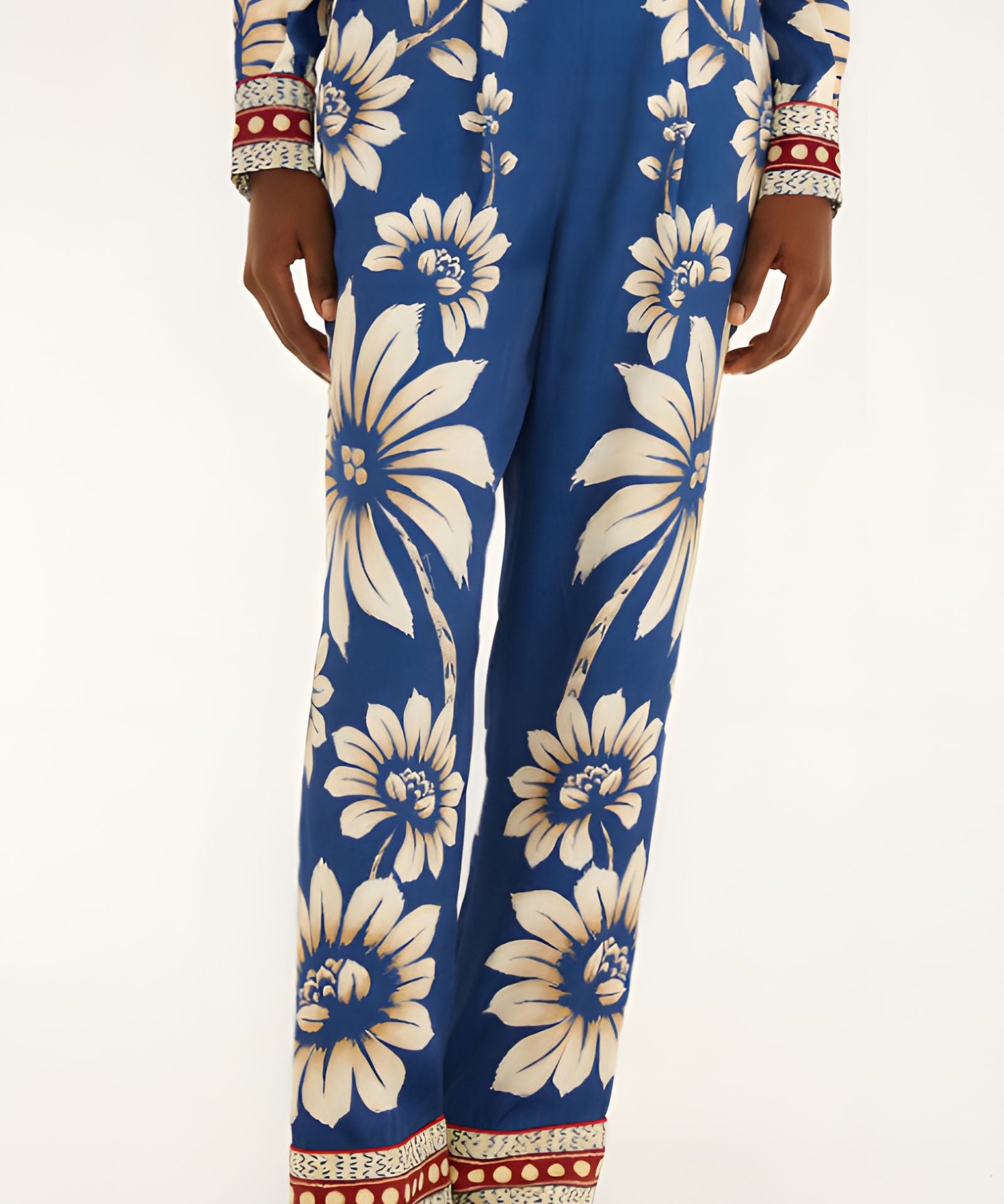 Close-up view of the Farm Rio Blue Luna pajama pants, highlighting the flowing wide-leg hem and contrast printed borders.