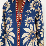 Close-up view of the Farm Rio Blue Luna pajama shirt, highlighting the classic notched collar, full button-down closure, and contrast printed cuffs.