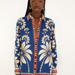 Front view of a model in a studio wearing the Farm Rio Blue Luna viscose pajama shirt with long sleeves and custom botanical print.