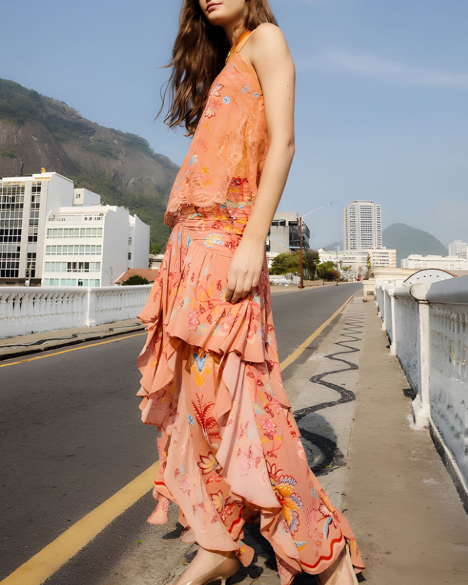 Model wearing FARM Rio mocha boho enhance ruffled maxi skirt with matching sleeveless top, full length view.