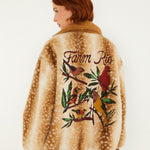 Farm Rio Borbofly reversible puffer jacket with a fawn print – back view with embroidered birds and flowers