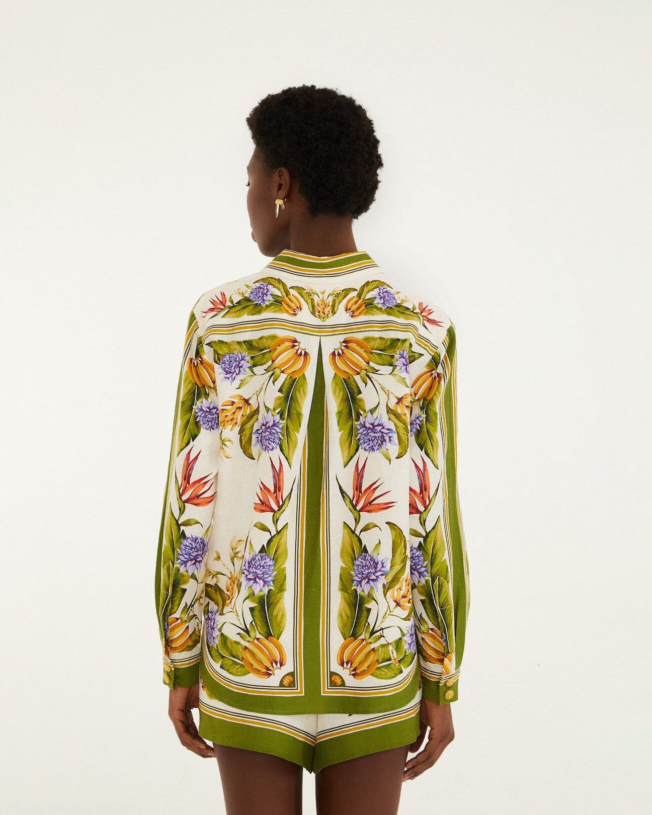 Back view of Farm Rio green botanical print shirt featuring tropical floral motifs, long sleeves and a relaxed fit.