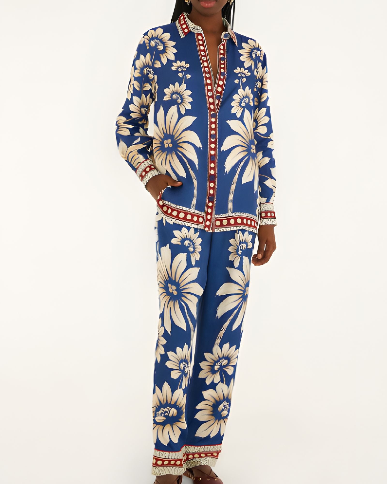 Full-length front view of a model wearing the FARM Rio Blue Luna pajama pants with a relaxed wide-leg cut and botanical print.