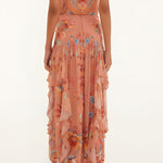 Back view of a model wearing the high-rise Farm Rio mocha boho ruffled maxi skirt.