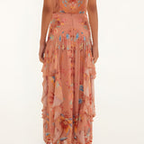 Back view of a model wearing the high-rise Farm Rio mocha boho ruffled maxi skirt.