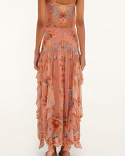 Back view of a model wearing the high-rise Farm Rio mocha boho ruffled maxi skirt.