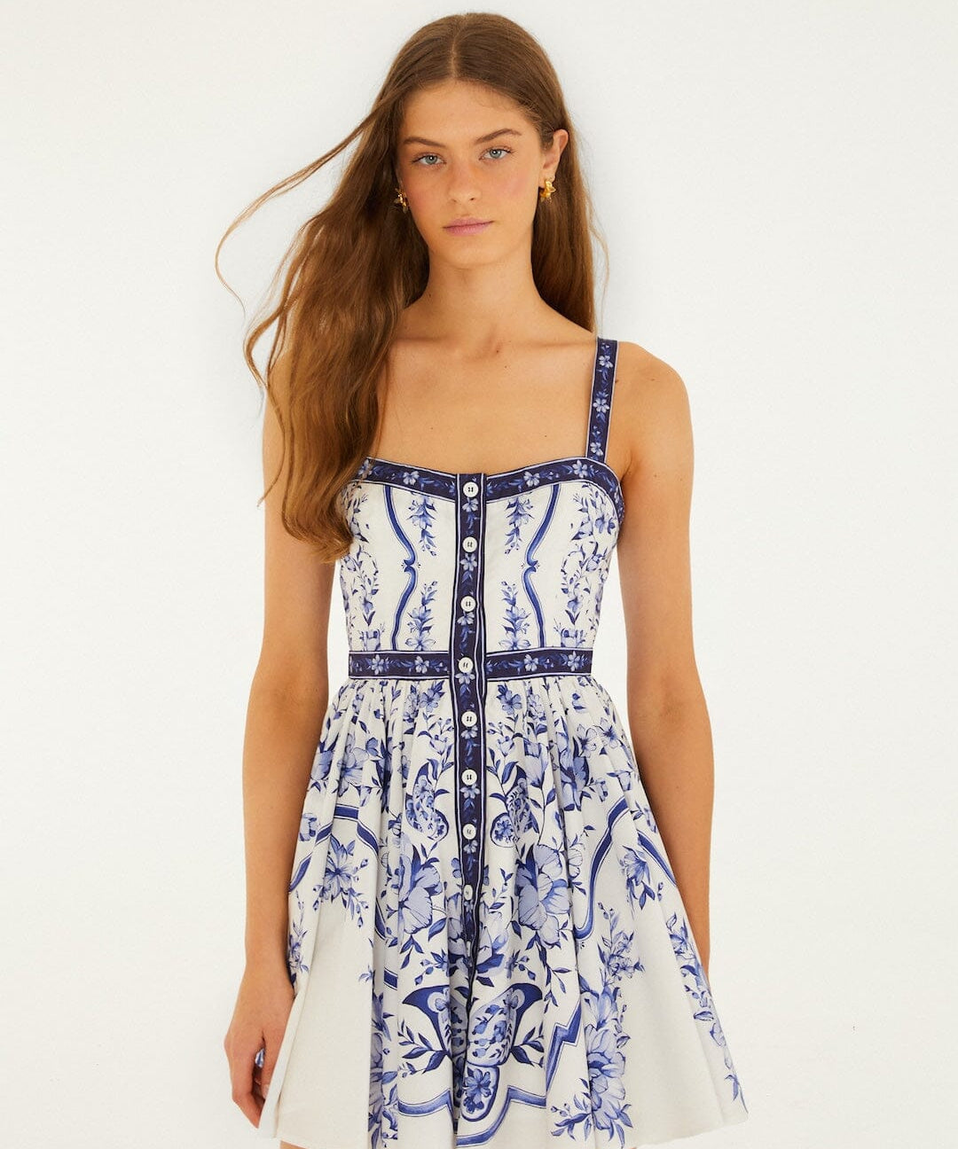 Model wearing FARM Rio off-white Porcelain Garden mini dress with hand-painted floral print, front view