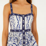 Detailed view of the hand-painted floral print and buttoned front on the FARM Rio Porcelain Garden mini dress