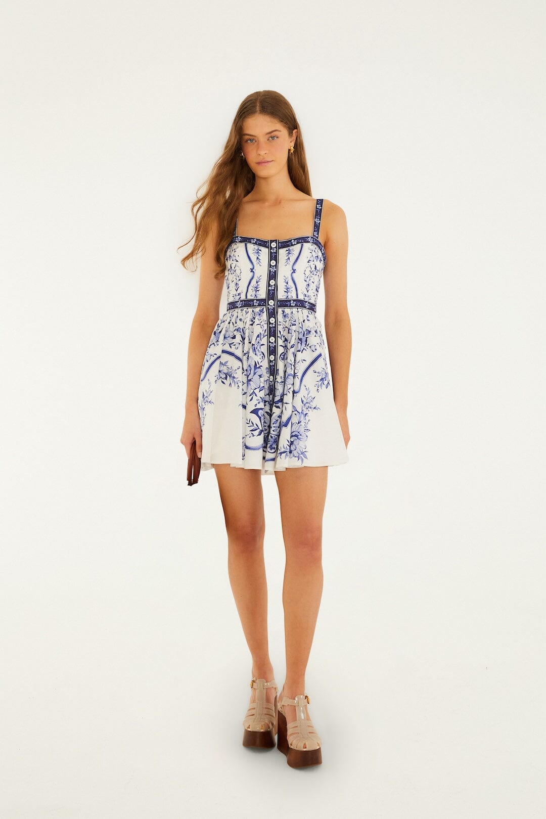 Back view of a model wearing the FARM Rio off-white Porcelain Garden mini dress