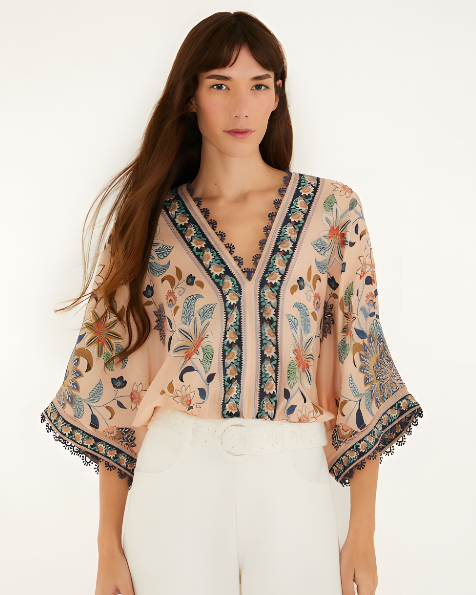 Front view of a model styling the soft pink Farm Rio floral tapestry bodysuit.