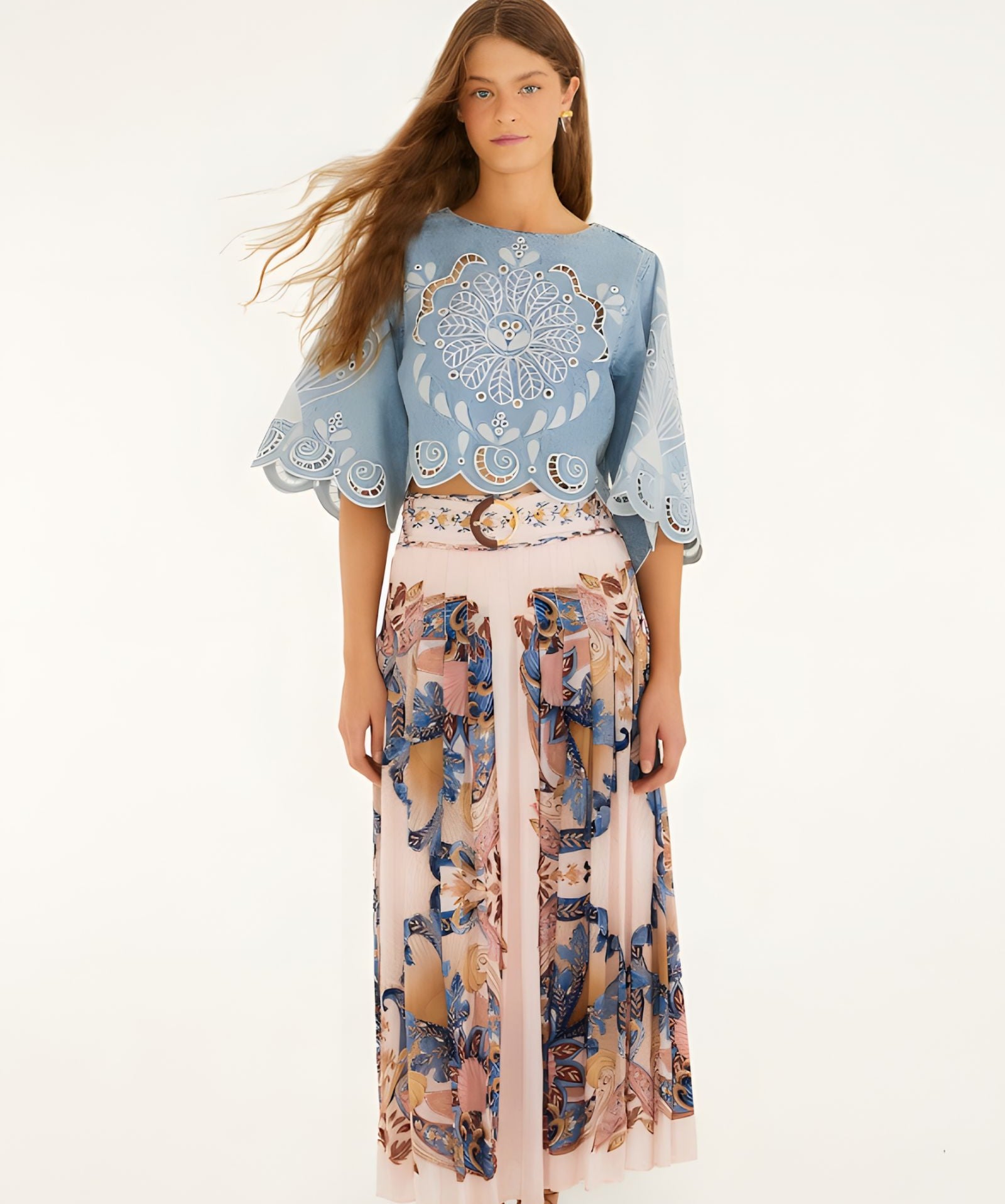 Model wearing Farm Rio soft pink pleated maxi skirt with sea-inspired scarf print, front view