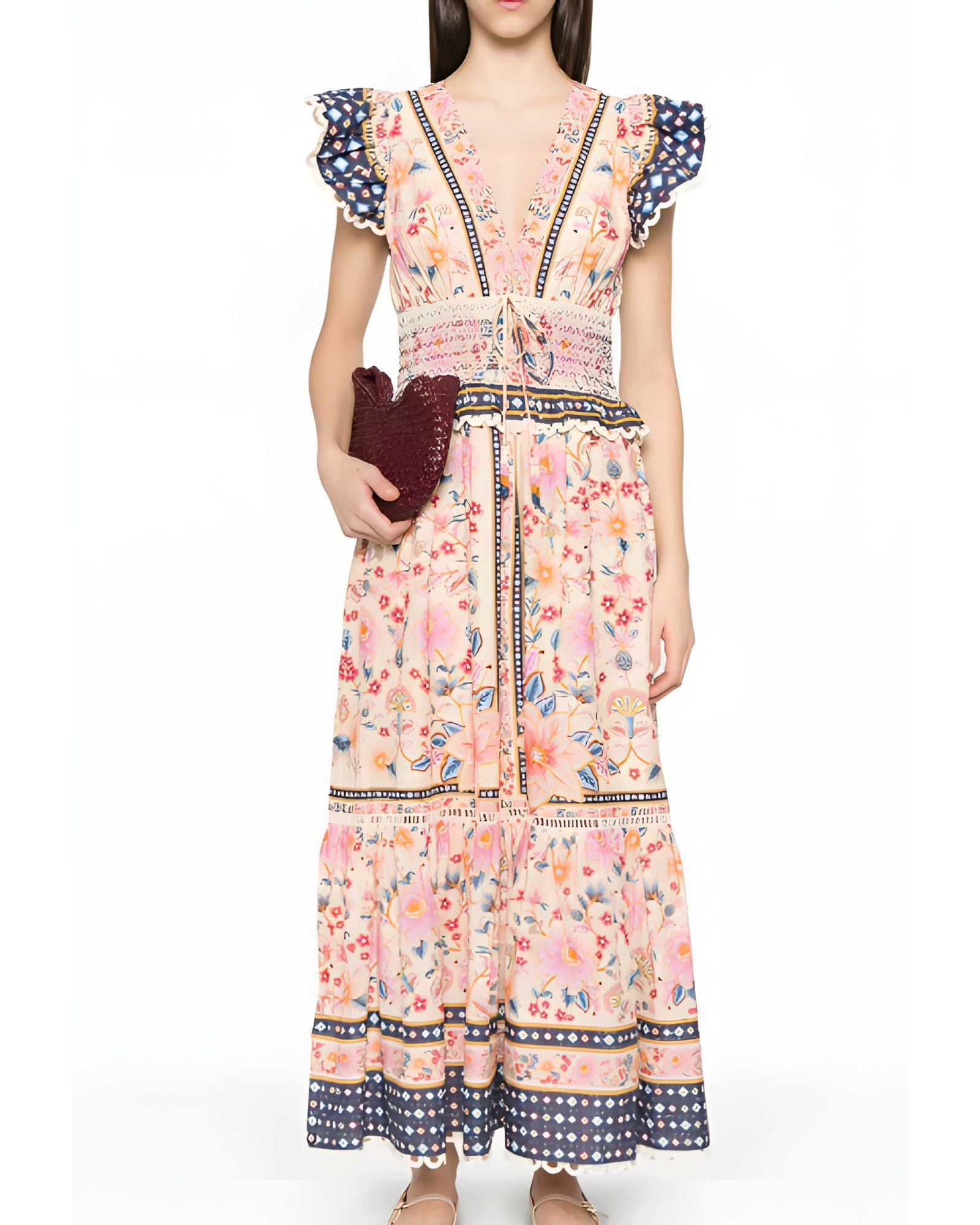 Full-length front view of a model styling the Farm Rio floral tapestry maxi dress, accessorized with a dark clutch bag.