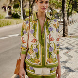 Farm Rio tropical botanical print shirt in green and cream with floral and banana motifs, relaxed fit and button-front design.