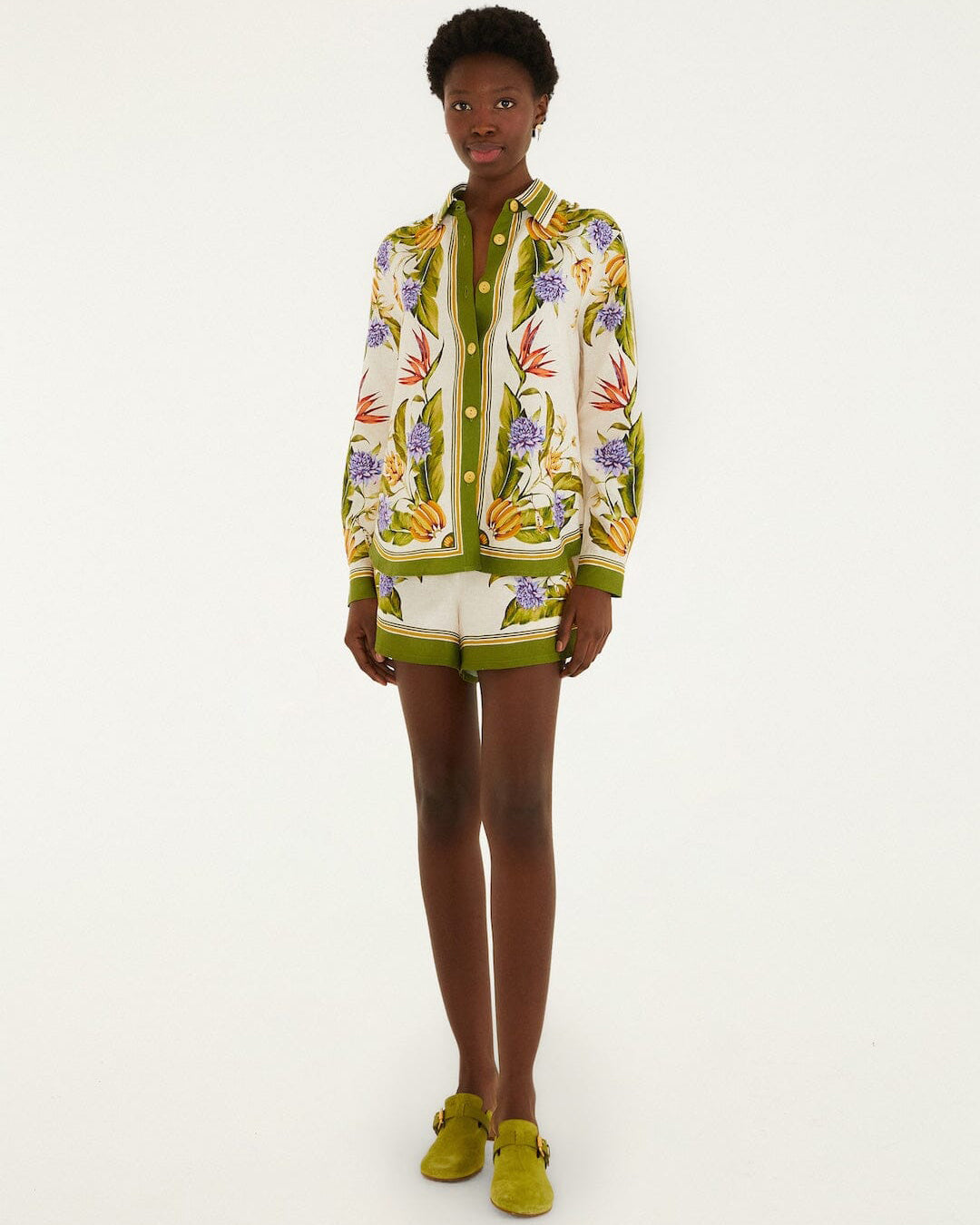 Model wearing a colorful floral-patterned outfit - shirt and short - by Brasilian brand Farm Rio