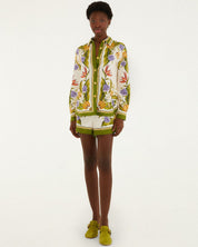 Model wearing a colorful floral-patterned outfit - shirt and short - by Brasilian brand Farm Rio