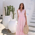 Open-Back Cotton Maxi Dress by INCERTAINES — model wearing the flowing cotton dress with elegant open back, front view