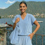 Soft Terry Cloth Shorts by INCERTAINES — model wearing the terry shorts with matching top, front view