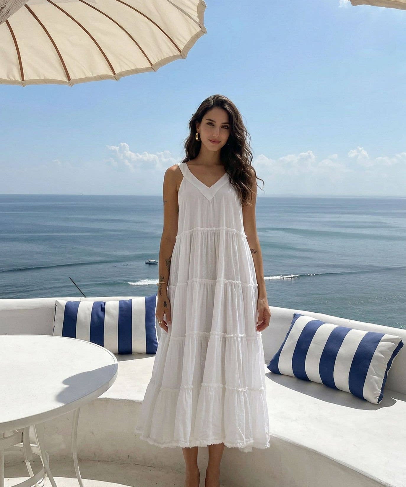 White Cotton Summer Dress by INCERTAINES — model wearing the relaxed one-size white cotton dress, front view