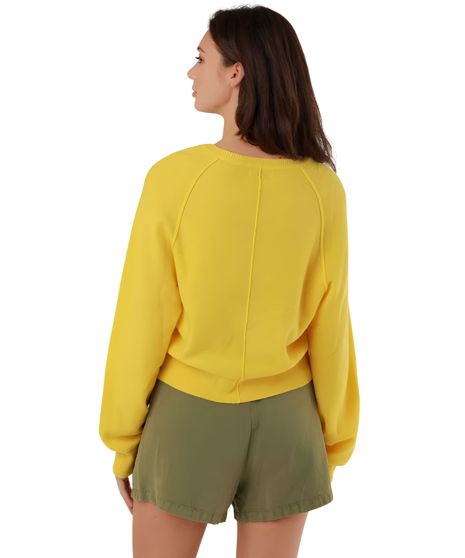 Rear three-quarter view of the yellow summer pullover, highlighting the relaxed oversize fit, seamless shoulder construction, and dropped balloon sleeves.