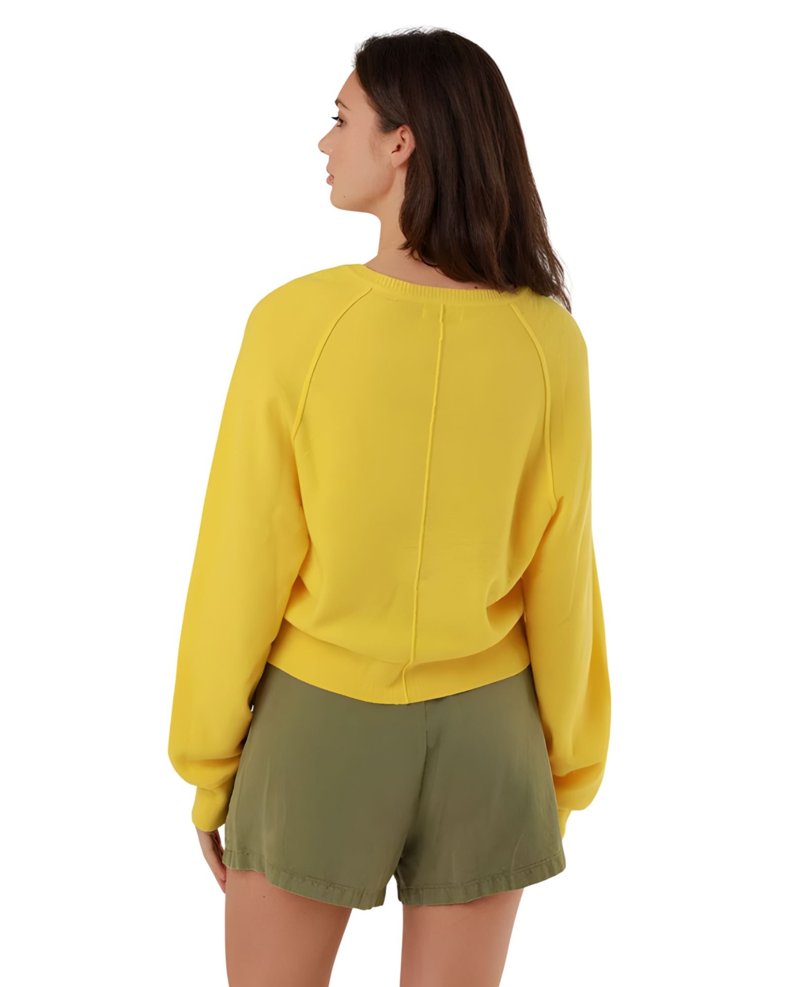 Rear three-quarter view of the yellow summer pullover, highlighting the relaxed oversize fit, seamless shoulder construction, and dropped balloon sleeves.