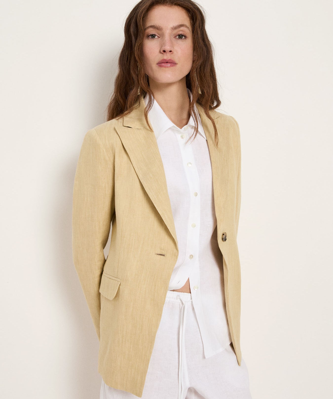 Khaki-creme single-button blazer on model, front view, worn with white shirt.