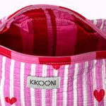 KIKOONI Love Edition pink cosmetic bag, open to show the red printed lining