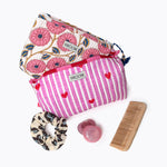 KIKOONI Love Edition pink cosmetic bag packed with a floral scarf, comb and essentials