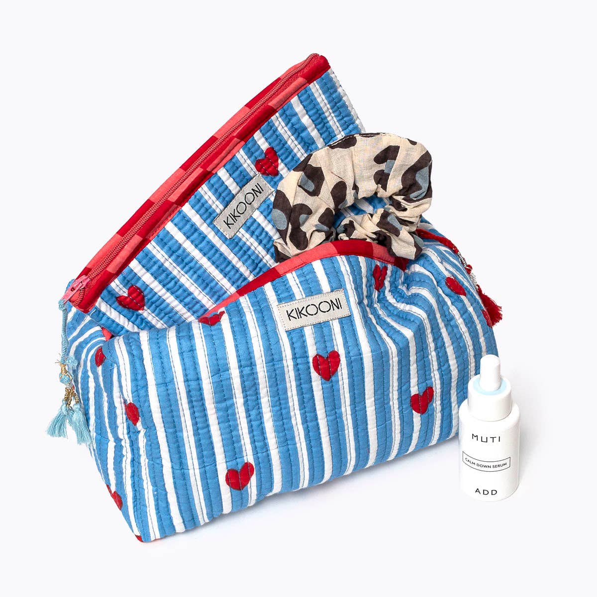 Two KIKOONI Love Edition blue mini pouches with a scarf and tassel