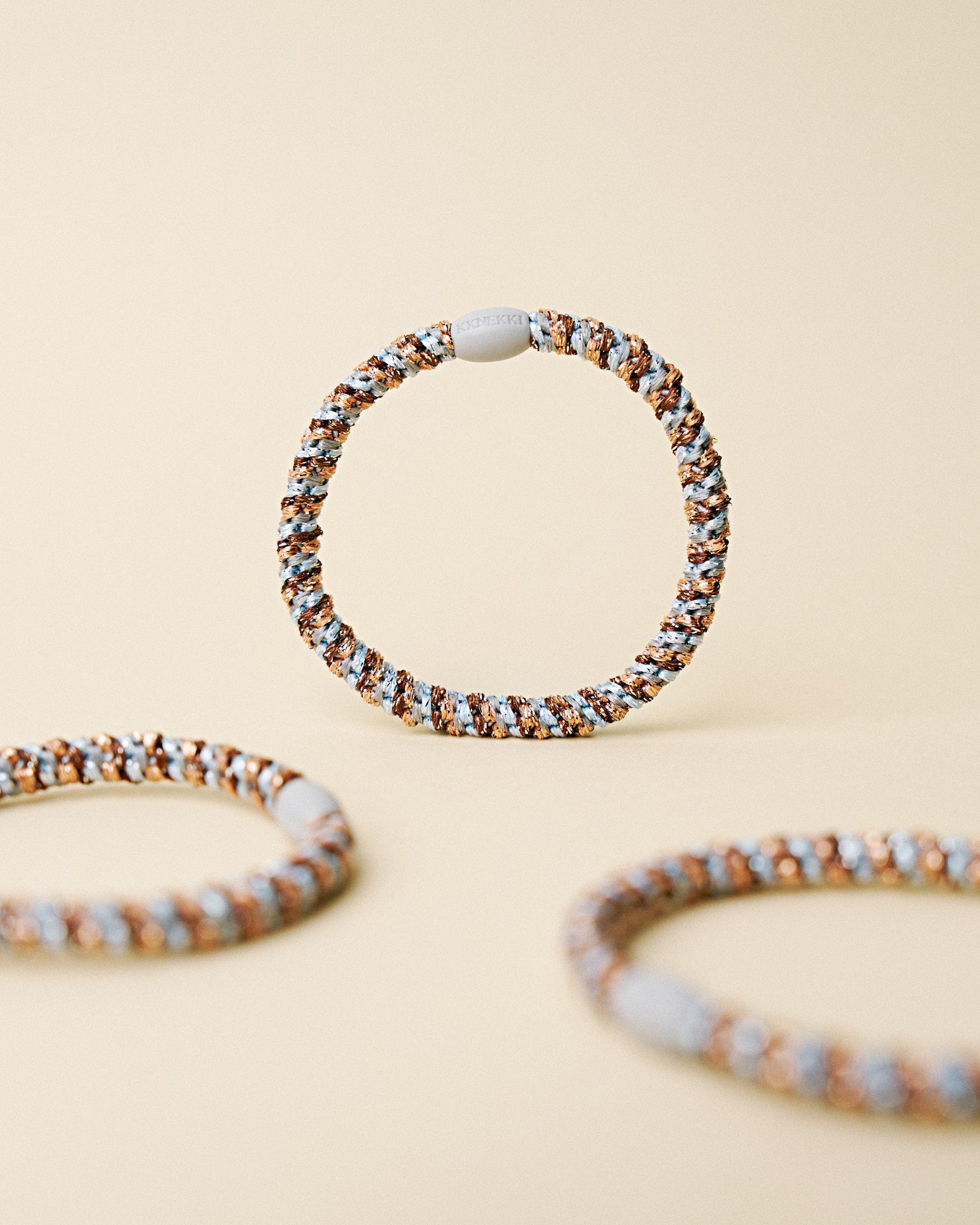 KKNEKKI slim hair tie Rose Gold & Sea Blue Mix – several hair ties together