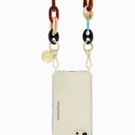 La Coque Française Amber resin chain attached to a clear phone case for crossbody wear.