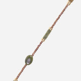 Close-up of the La Coque Française Izzie beaded phone chain in sage green