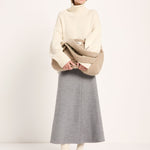 LANIUS oversized jumper in off-white organic virgin wool and cotton, worn by a model