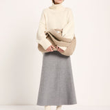 LANIUS oversized jumper in off-white organic virgin wool and cotton, worn by a model