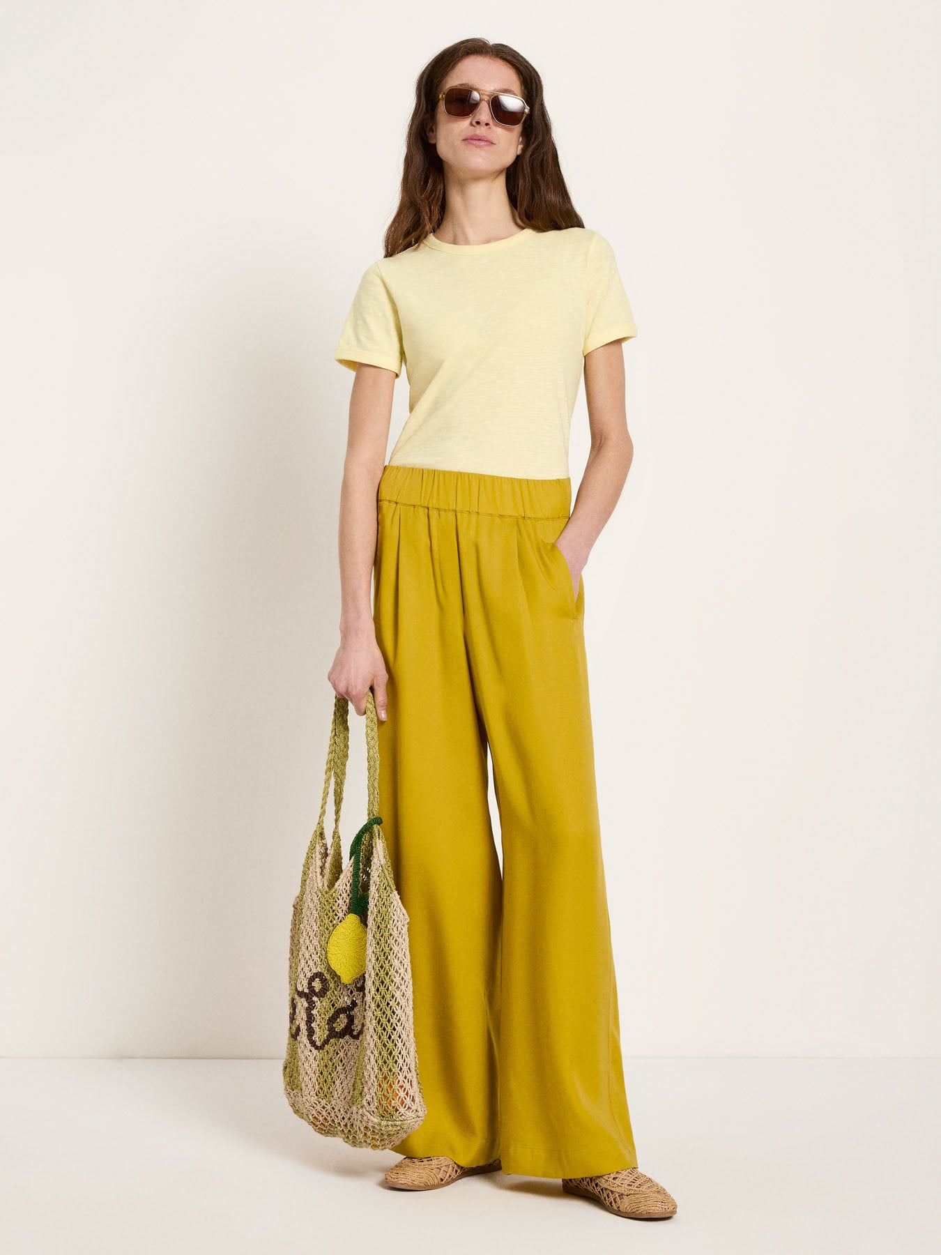 Wide-leg trousers - Dark Kiwi by LANIUS — fair fashion in organic materials, front view