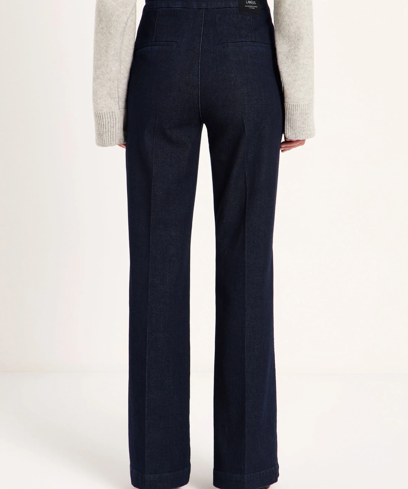 LANIUS Willow flared jeans in rinsed raw denim, back view