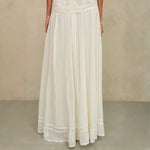 Mid-length view of the flowing cream cotton artisan maxi skirt by Mabe Apparel.