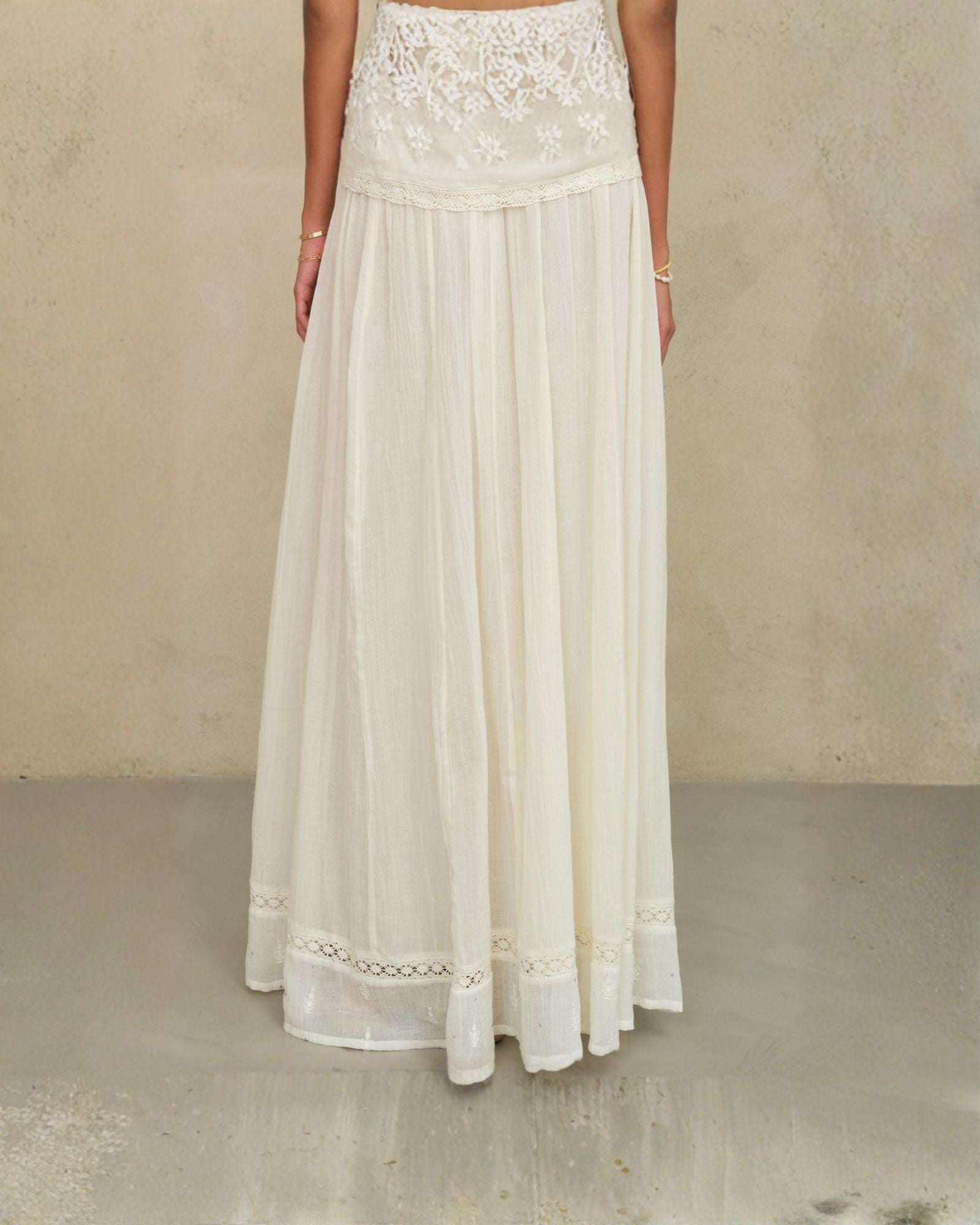 Mid-length view of the flowing cream cotton artisan maxi skirt by Mabe Apparel.