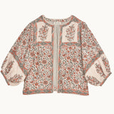 Mabe Apparel printed cotton jacket with puff sleeves in a coral red and olive green floral pattern.