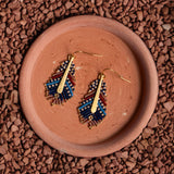 Ethically handcrafted blue and brown Miyuki beaded earrings in a delicate feather design by Mayana Designs