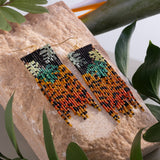 Close-up of Mayana Designs Beaded Handwoven Jaguar Fringe Earrings, highlighting the intricate beadwork and vibrant colors