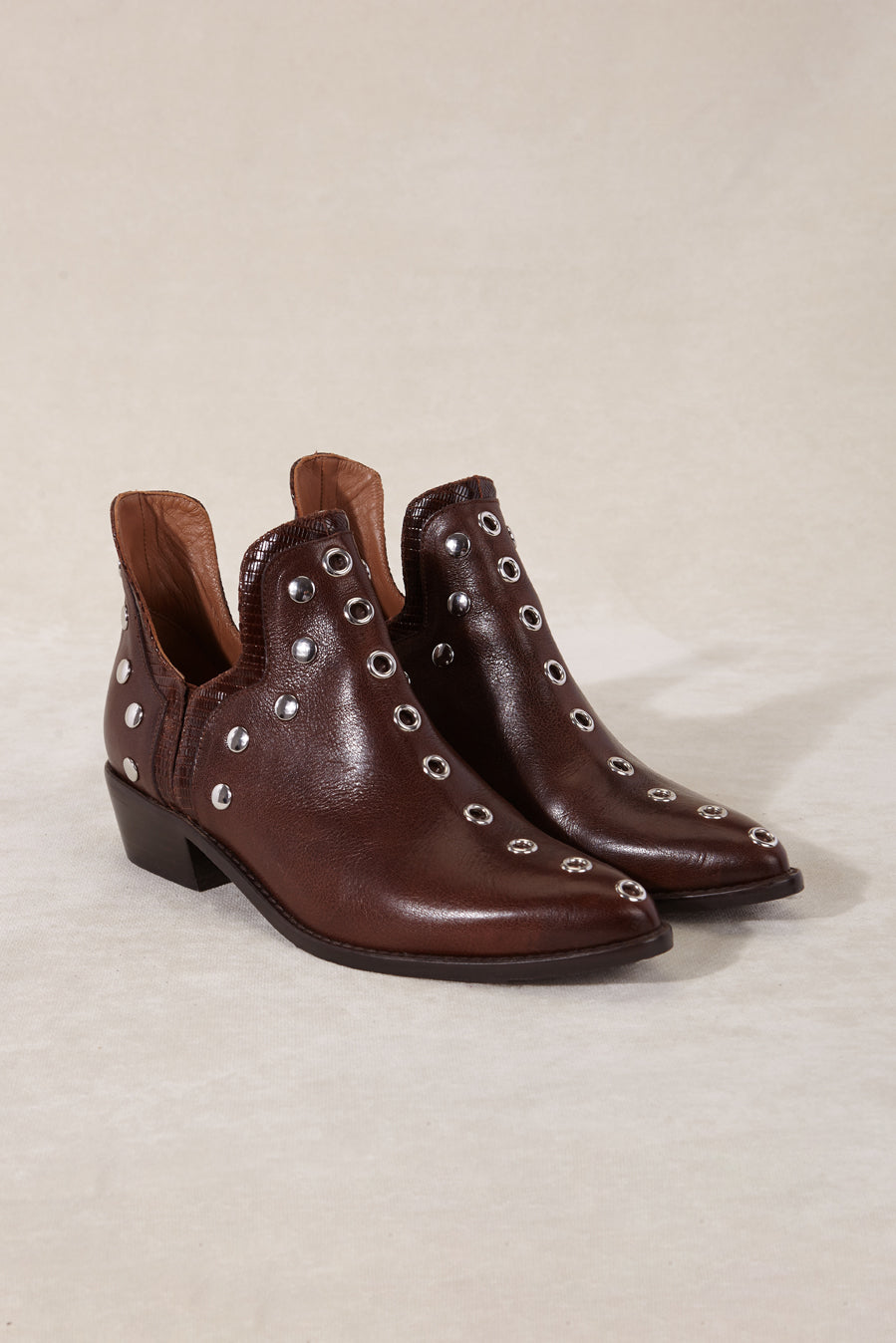 MICUIR Punky ankle boots in chocolate leather with silver studs, pair three-quarter view