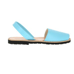 Minorquines aquamarine blue leather avarca sandal worn on the foot, side view