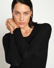 Close-up of MMElaine Seamless Silk Tee in Black, sleeve detail