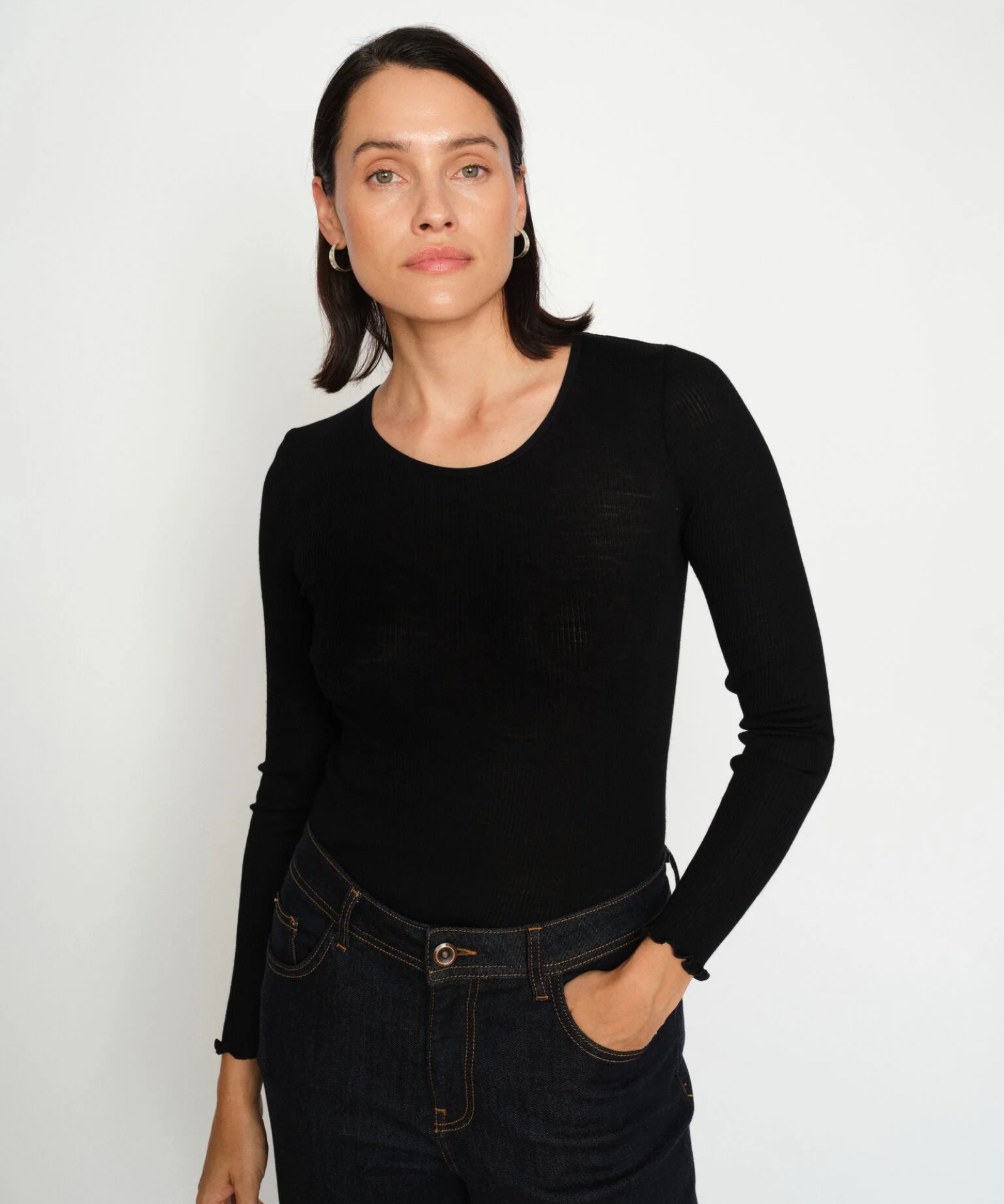Model wearing MMElaine Seamless Silk Tee in Black, front pose