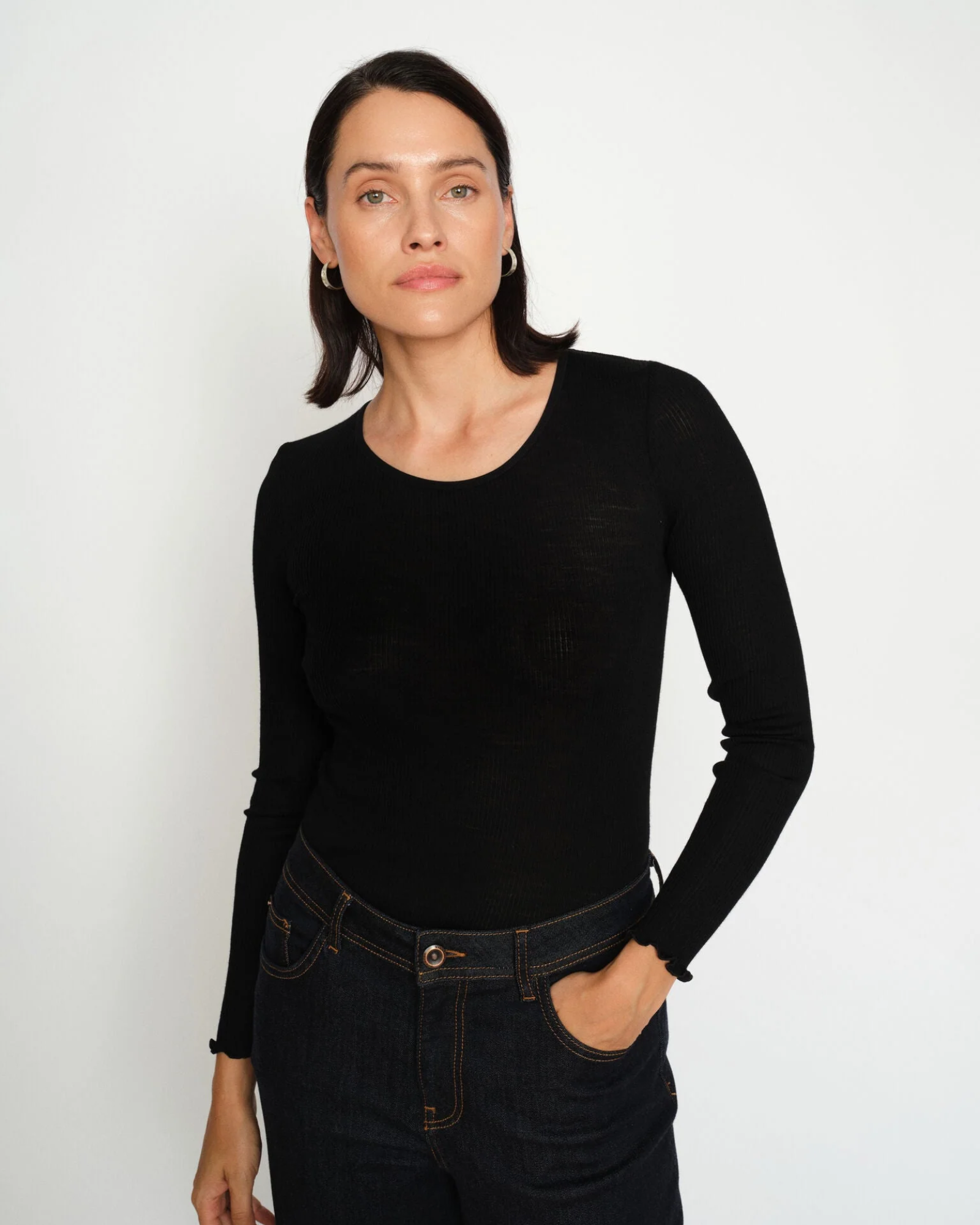 Model wearing MMElaine Seamless Silk Tee in Black, front pose