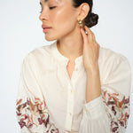 MOS MOSH Notto embroidered shirt in ecru with a band collar and openwork embroidery on the sleeves, worn by a model