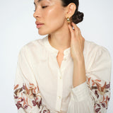 MOS MOSH Notto embroidered shirt in ecru with a band collar and openwork embroidery on the sleeves, worn by a model
