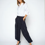 MOS MOSH Nuello Trellis 7/8 balloon trousers in salute navy with a balloon leg gathered at the ankle, worn by a model, front view