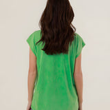 Rear view of the 100% cotton green Molly t-shirt on a model, highlighting its comfortable straight fit and clean silhouette.