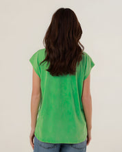 Rear view of the 100% cotton green Molly t-shirt on a model, highlighting its comfortable straight fit and clean silhouette.